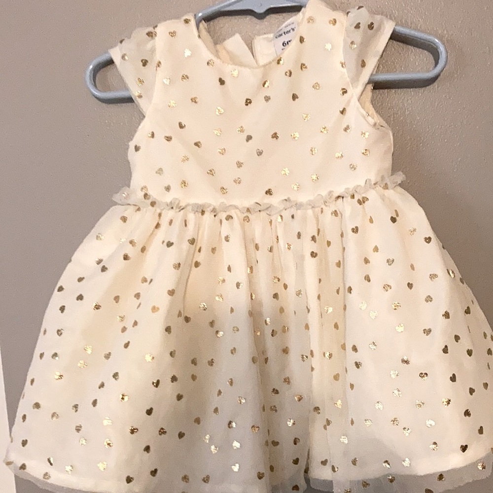 It's made by Carter's 6 month, it's white with gold hearts, soft lining.